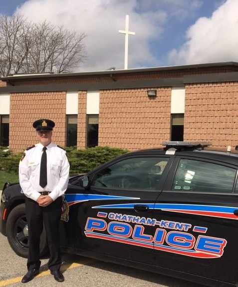 Chaplain with police cruiser